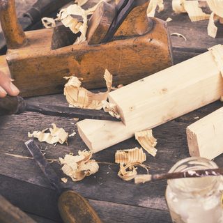 carving the wood with chisel